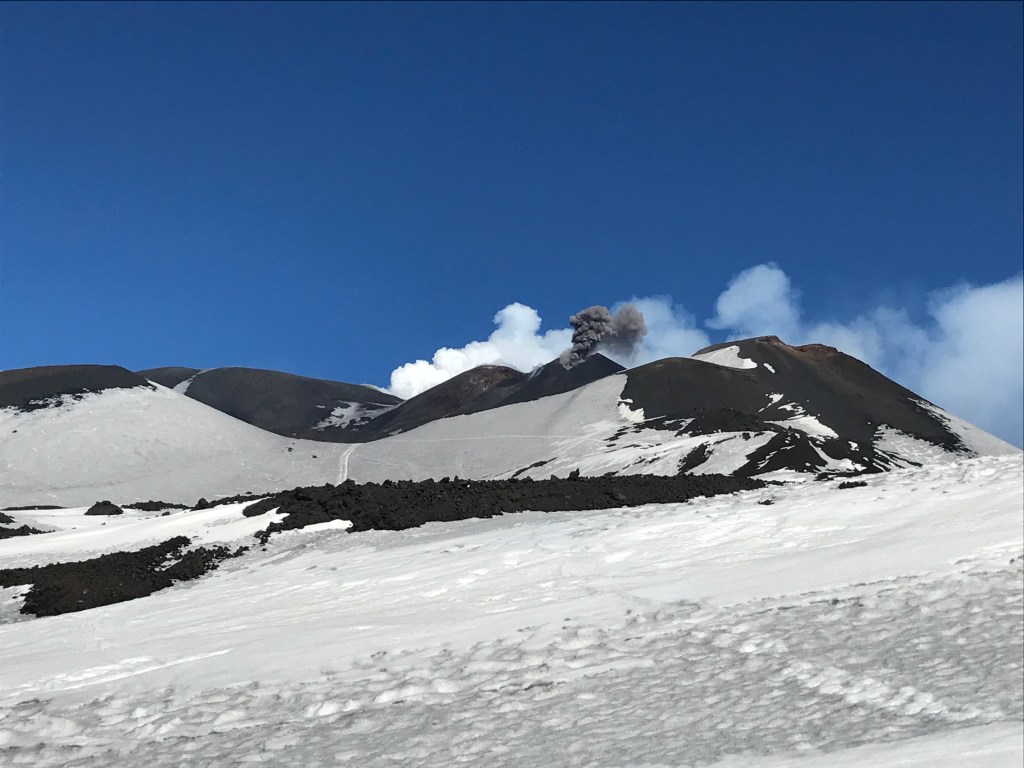 Etna Sud summit with black and white smoke